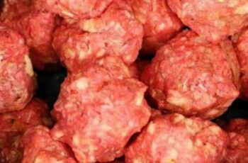 Put meatballs in a slow cooker, but the next 2 ingredients will make it special