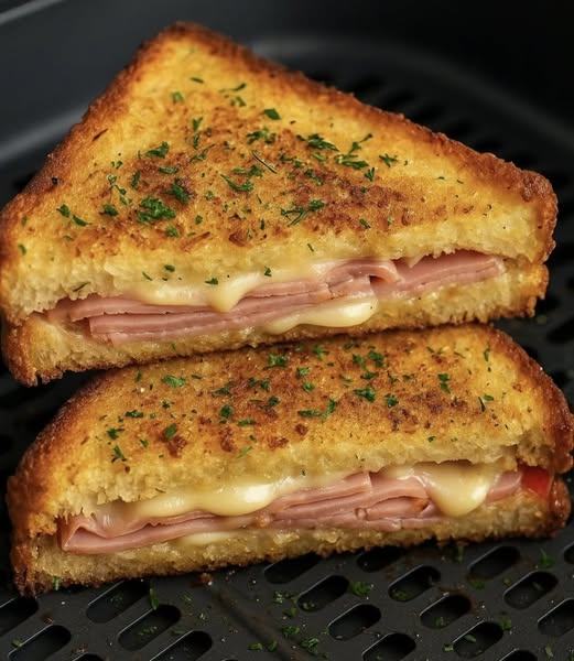 crispy, golden-brown grilled ham and cheese sandwich